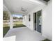 An open patio area features a ceiling fan and sliding glass doors at 4470 Frances Ave, Sanford, FL 32773