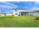 Backyard featuring a well-kept lawn, white fence and mature tree at 5433 Keaton Springs Dr, Lakeland, FL 33811