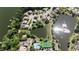 Aerial view of the community featuring homes, ponds, community pool and tennis courts at 619 Blenheim Loop, Winter Springs, FL 32708