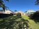Large grassy backyard with a privacy fence at 619 Blenheim Loop, Winter Springs, FL 32708