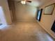 Spacious bedroom featuring neutral carpeting, fan, and window dressed with blue curtains for ample light control at 619 Blenheim Loop, Winter Springs, FL 32708