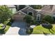 Charming single-Gathering home featuring a two-car garage and lush landscaping at 619 Blenheim Loop, Winter Springs, FL 32708