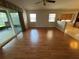 Living room with hardwood floors, sliding glass doors, and recessed lighting at 619 Blenheim Loop, Winter Springs, FL 32708