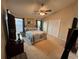 Main bedroom featuring a ceiling fan, carpet flooring, and double door closet at 619 Blenheim Loop, Winter Springs, FL 32708