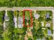 Aerial view of the property showing a large lot with mature trees and a home with a red boundary line at 651 W Lake Brantley Rd, Altamonte Springs, FL 32714