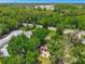 An aerial perspective showing the property nestled among mature trees, near roads, and commercial area at 651 W Lake Brantley Rd, Altamonte Springs, FL 32714