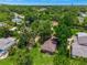 An aerial view that captures the home's setting amongst lush greenery in a tranquil neighborhood at 651 W Lake Brantley Rd, Altamonte Springs, FL 32714