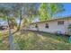 The backyard features a chain-link fence, green grass, and well maintained landscaping at 651 W Lake Brantley Rd, Altamonte Springs, FL 32714