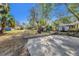 Spacious backyard featuring mature trees, a playhouse and room for activities at 651 W Lake Brantley Rd, Altamonte Springs, FL 32714