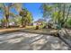 Expansive backyard with a playhouse, mature trees, and plenty of space for outdoor activities at 651 W Lake Brantley Rd, Altamonte Springs, FL 32714