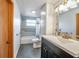 Updated bathroom with a shower-tub combo, gray tile, and a modern vanity at 651 W Lake Brantley Rd, Altamonte Springs, FL 32714