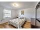 Cozy bedroom with natural light, hardwood floors, and a serene ambiance at 651 W Lake Brantley Rd, Altamonte Springs, FL 32714