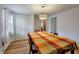 Open concept dining room with hardwood floors, modern chandelier, and closet for storage at 651 W Lake Brantley Rd, Altamonte Springs, FL 32714