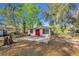 Charming single-story house with a red door, patio, and mature trees at 651 W Lake Brantley Rd, Altamonte Springs, FL 32714