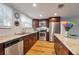 Updated kitchen with stainless steel appliances, granite countertops, and wood-look flooring for a modern feel at 651 W Lake Brantley Rd, Altamonte Springs, FL 32714