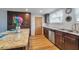 Bright kitchen with granite countertops, stainless steel appliances, and ample dark wood cabinet space at 651 W Lake Brantley Rd, Altamonte Springs, FL 32714