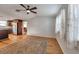 Living room featuring an open floor plan to the kitchen, wood floors, and natural light at 651 W Lake Brantley Rd, Altamonte Springs, FL 32714