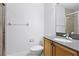 Clean bathroom featuring tile shower and granite countertop vanity at 674 Whisper Woods Dr, Lakeland, FL 33813