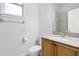 Updated bathroom with tan cabinets, granite countertop and shower/tub combo at 674 Whisper Woods Dr, Lakeland, FL 33813
