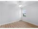 Bright bedroom featuring hardwood floors and ceiling fan at 674 Whisper Woods Dr, Lakeland, FL 33813