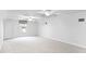 Expansive bonus room with multiple ceiling fans and ample space at 674 Whisper Woods Dr, Lakeland, FL 33813