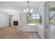 Cozy breakfast nook with a view of the backyard and a fireplace in the distance at 674 Whisper Woods Dr, Lakeland, FL 33813