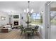 Inviting breakfast nook with views of pool and backyard through large window at 674 Whisper Woods Dr, Lakeland, FL 33813