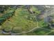Aerial view of golf course and cart paths lined by homes at 674 Whisper Woods Dr, Lakeland, FL 33813
