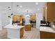 Bright kitchen with stainless steel appliances, island, quartz countertops, and elegant hexagon tile backsplash at 674 Whisper Woods Dr, Lakeland, FL 33813