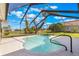 Enclosed pool area featuring a uniquely shaped pool, mature trees, and a screened enclosure at 674 Whisper Woods Dr, Lakeland, FL 33813