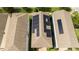 Aerial view of homes with solar panels, manicured lawns, and mature trees at 7853 Summerlake Groves St, Winter Garden, FL 34787