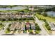 Aerial view of a neighborhood with homes, green spaces, and lake views at 7853 Summerlake Groves St, Winter Garden, FL 34787