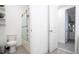 Clean bathroom featuring a white toilet and a shower/tub combo with glass doors at 7853 Summerlake Groves St, Winter Garden, FL 34787
