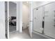 Bright bathroom with glass-enclosed shower, toilet, and doorway that leads into the main bedroom at 7853 Summerlake Groves St, Winter Garden, FL 34787