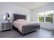 Elegant bedroom featuring a stylish bed, mirrored nightstand, and modern decor at 7853 Summerlake Groves St, Winter Garden, FL 34787