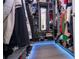 Organized walk-in closet features custom shelving, drawers, clothing racks, mirror, and floor lighting at 7853 Summerlake Groves St, Winter Garden, FL 34787