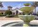 Community clubhouse entrance featuring a tiered fountain and manicured landscaping, perfect for social gatherings at 7853 Summerlake Groves St, Winter Garden, FL 34787