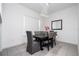 Chic dining room with gray upholstered chairs and modern chandelier at 7853 Summerlake Groves St, Winter Garden, FL 34787