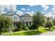 Charming two-story home with well-manicured lawn and healthy, mature trees at 7853 Summerlake Groves St, Winter Garden, FL 34787