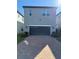 Home featuring a spacious two-car garage and a brick-paved driveway at 7853 Summerlake Groves St, Winter Garden, FL 34787
