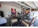 Versatile garage space with dining set, grill, and artistic decor at 7853 Summerlake Groves St, Winter Garden, FL 34787