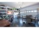 Spacious garage featuring epoxy floors, tv and table with chairs at 7853 Summerlake Groves St, Winter Garden, FL 34787