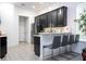 The kitchen is outfitted with bar seating and stainless steel appliances at 7853 Summerlake Groves St, Winter Garden, FL 34787