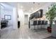 Open-concept design shows a well-appointed kitchen with bar seating adjacent to a beautifully decorated living area at 7853 Summerlake Groves St, Winter Garden, FL 34787