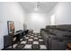 Modern living room with gray sofa, area rug and entertainment center at 7853 Summerlake Groves St, Winter Garden, FL 34787