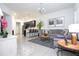 Bright living room boasts neutral tones, a large sectional sofa, and stylish decor for comfortable and modern living at 7853 Summerlake Groves St, Winter Garden, FL 34787