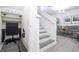 Efficient office space under stairs, perfect for work/study, with shelving and modern design elements at 7853 Summerlake Groves St, Winter Garden, FL 34787