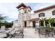 Outdoor pool area showing a stone tower, a seating area with tables, and sign pointing to the pool restrooms at 7853 Summerlake Groves St, Winter Garden, FL 34787