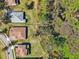 An aerial view of a neighborhood featuring well-maintained lawns and tile roofs at 8064 Peaceful Cir, Sanford, FL 32771