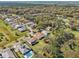 Wide aerial shot showing the community's layout, tree coverage, and residential density at 8064 Peaceful Cir, Sanford, FL 32771